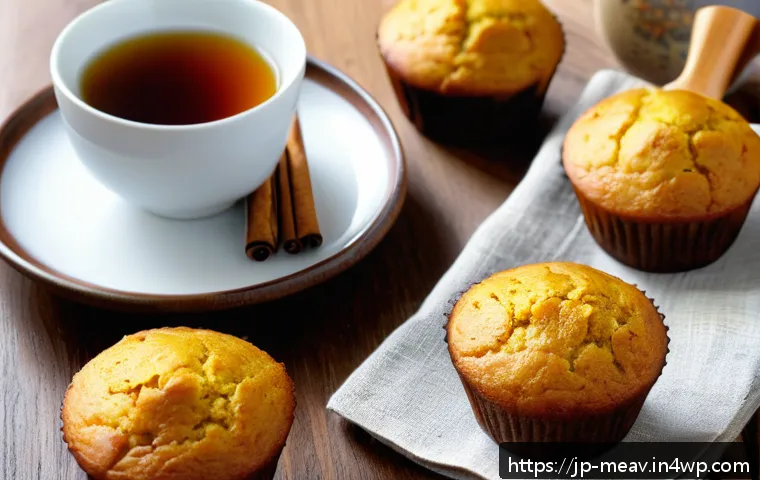 항염증 식단을 위한 베이킹 아이디어 - A warm and inviting kitchen scene featuring a freshly baked batch of golden turmeric muffins on a ru...